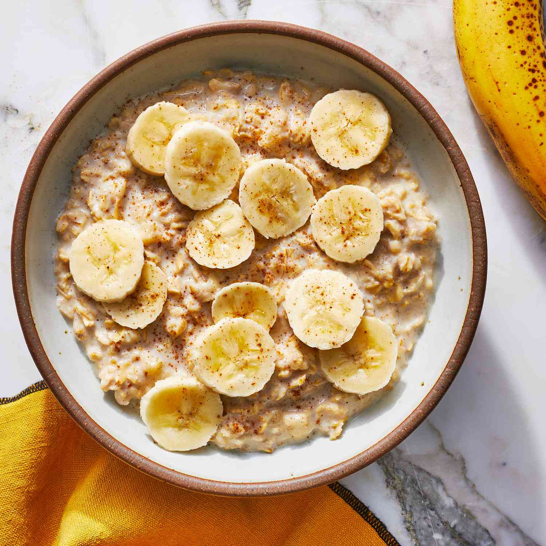 protein oat porridge topped with banana and cinnamon